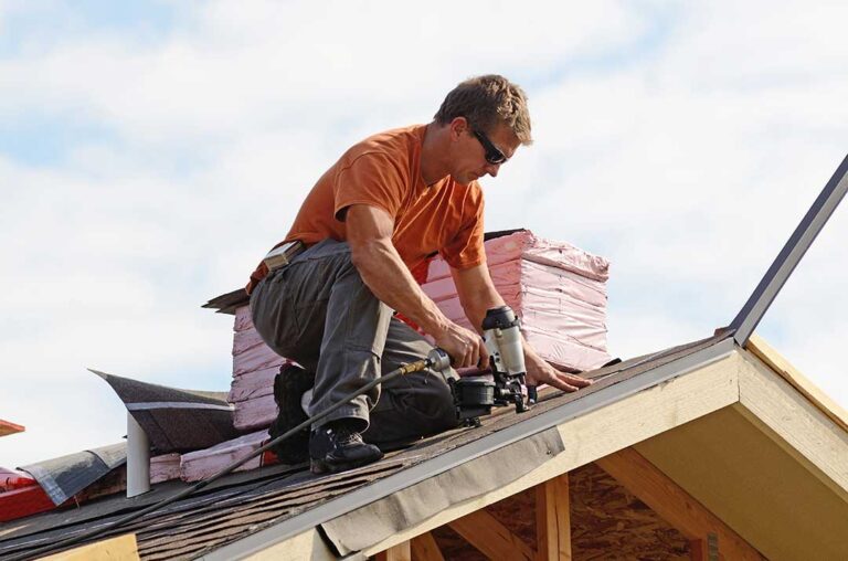 Close-up of soffit and fascia under the eaves of a residential roof during sunny weather.